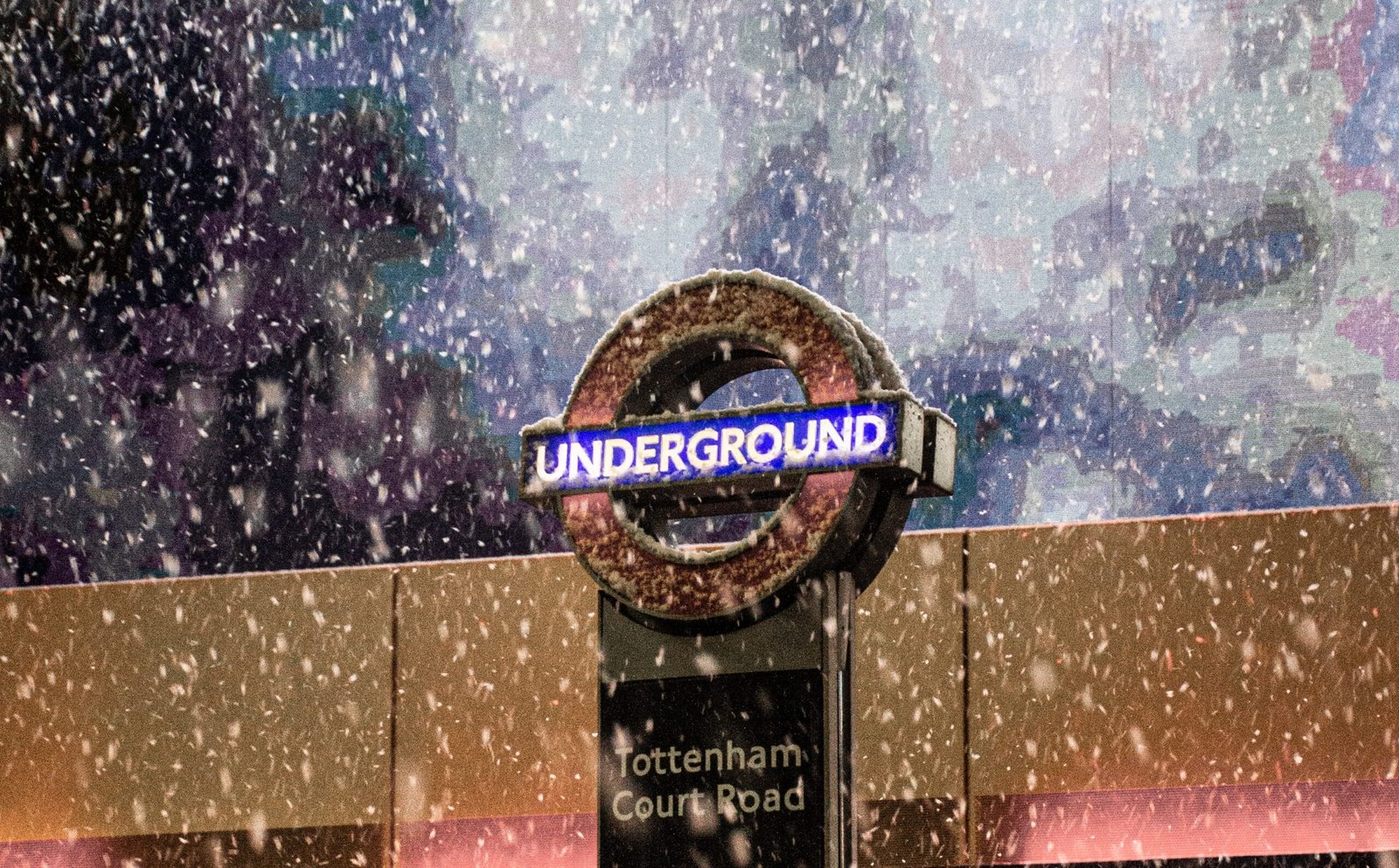 a london underground sign in the snow