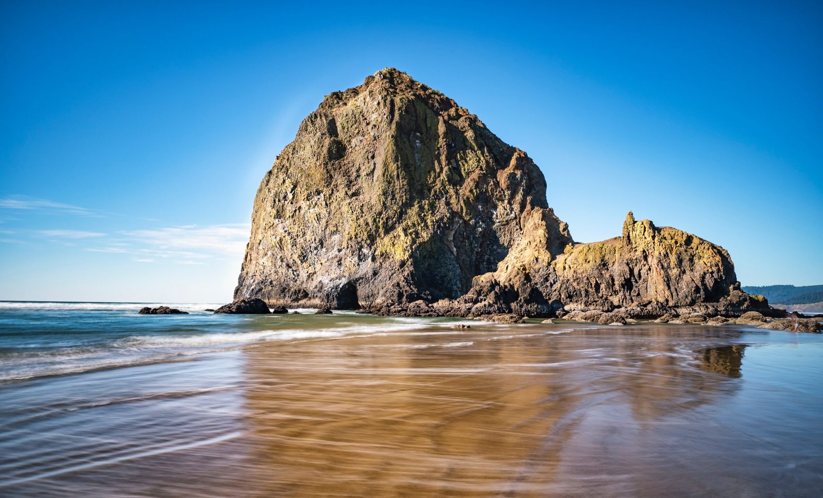 brown rock formation on sea shore during daytime