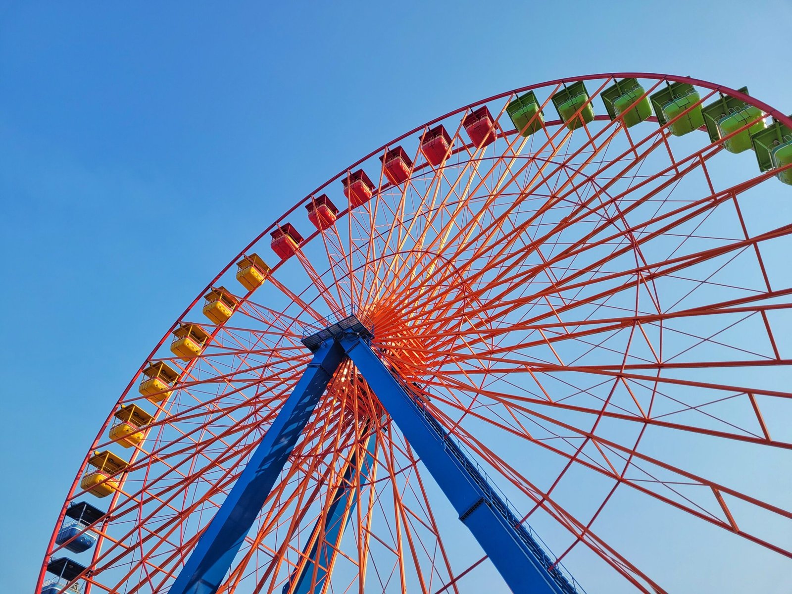 a ferris wheel with a blue sky in the background