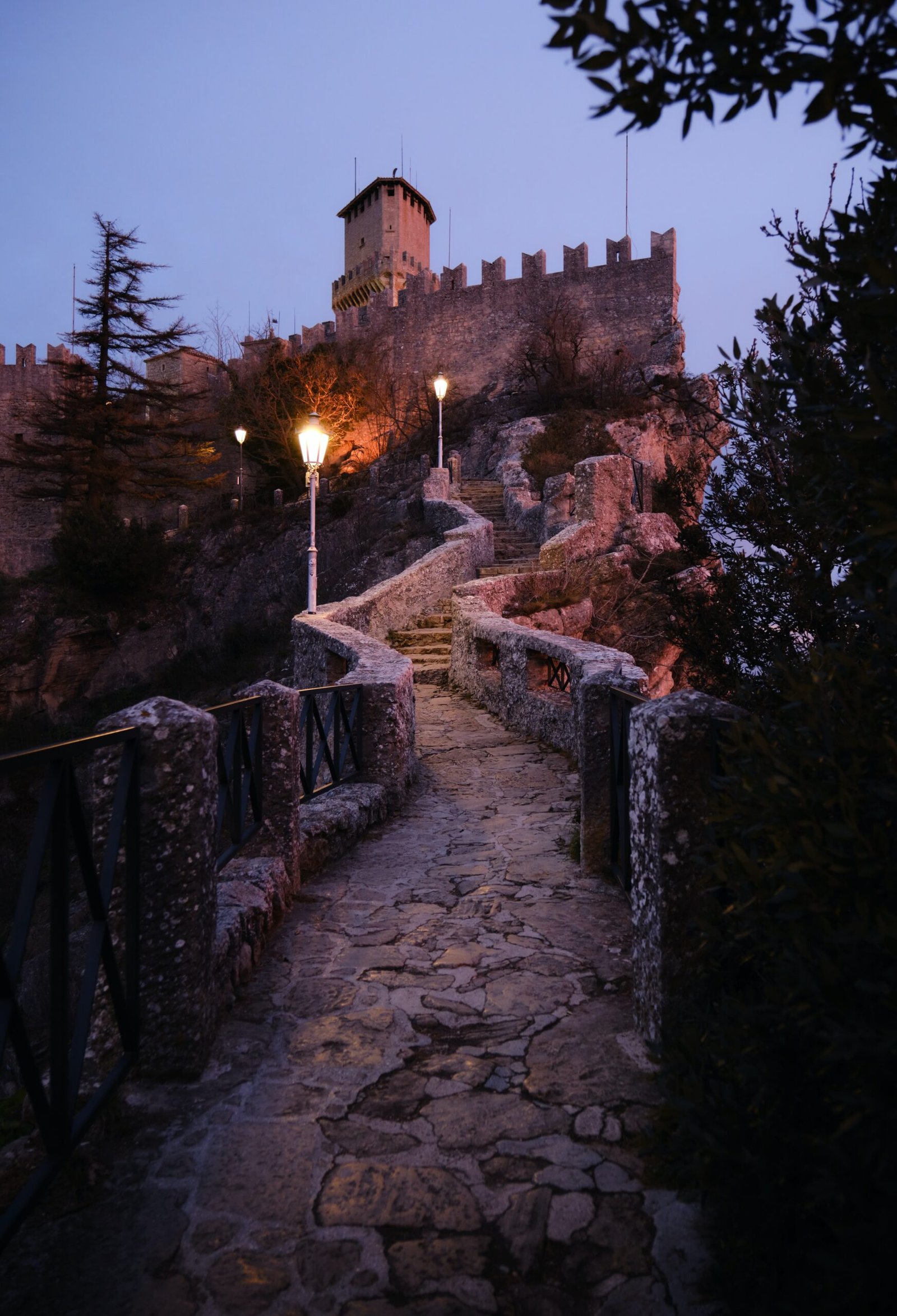 a stone path leading up to a castle