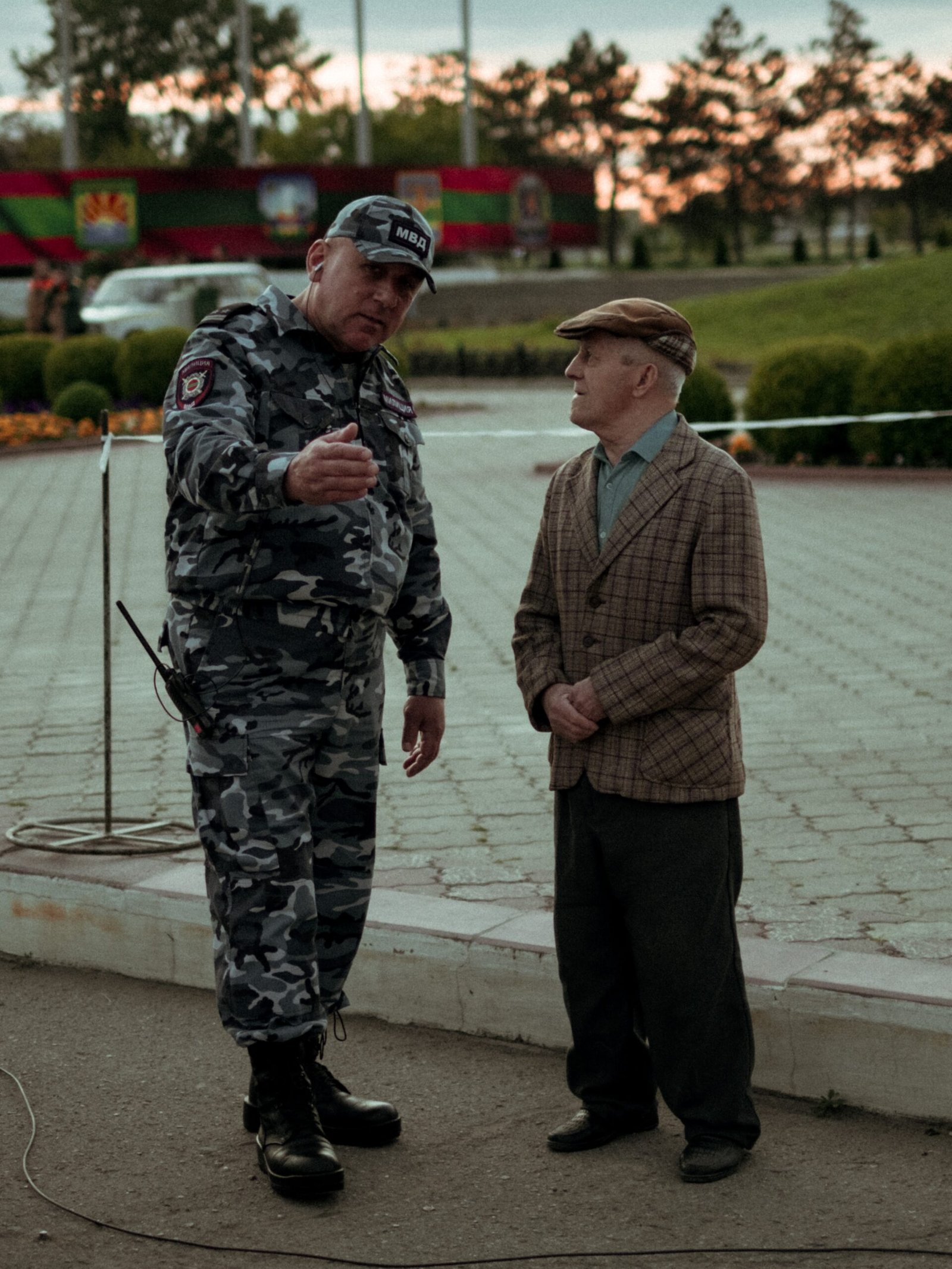 man in black and brown camouflage jacket standing beside man in brown and black camouflage jacket