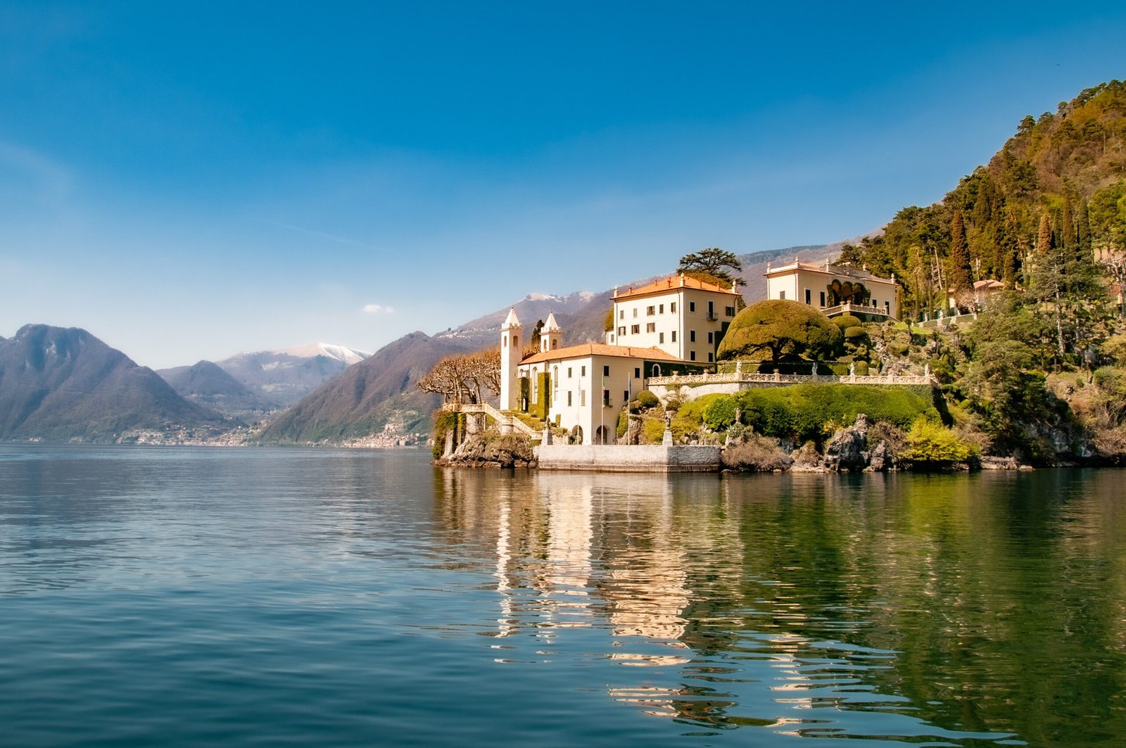 white concrete building near body of water during daytime